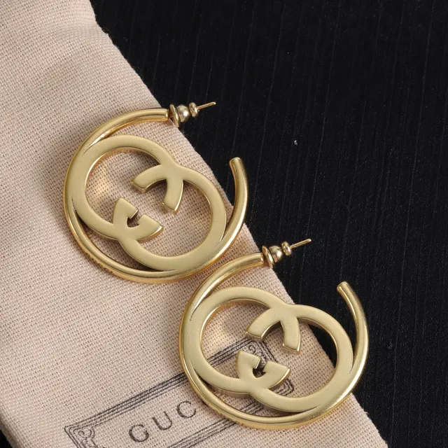 Boucles d'oreilles Gucci Double G en métal doré avec logo interlocking 3