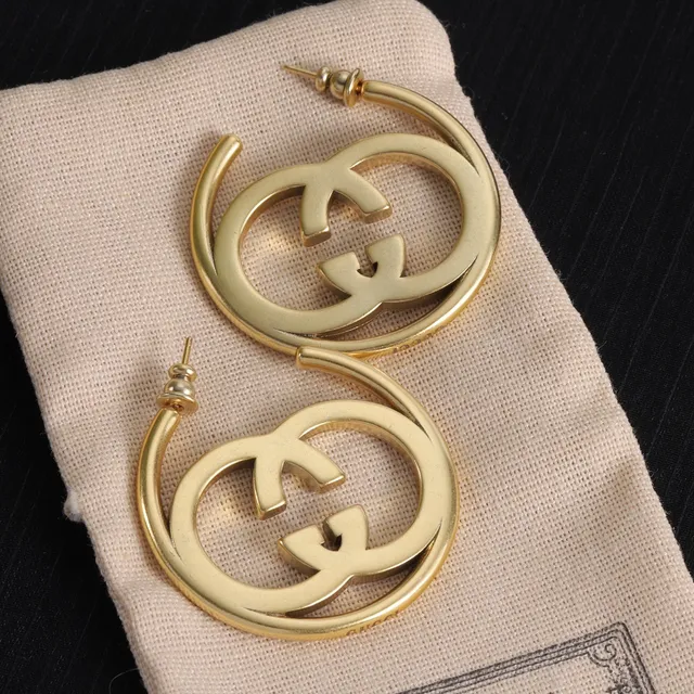 Boucles d'oreilles Gucci Double G en métal doré avec logo interlocking 4