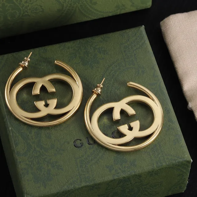 Boucles d'oreilles Gucci Double G en métal doré avec logo interlocking 6