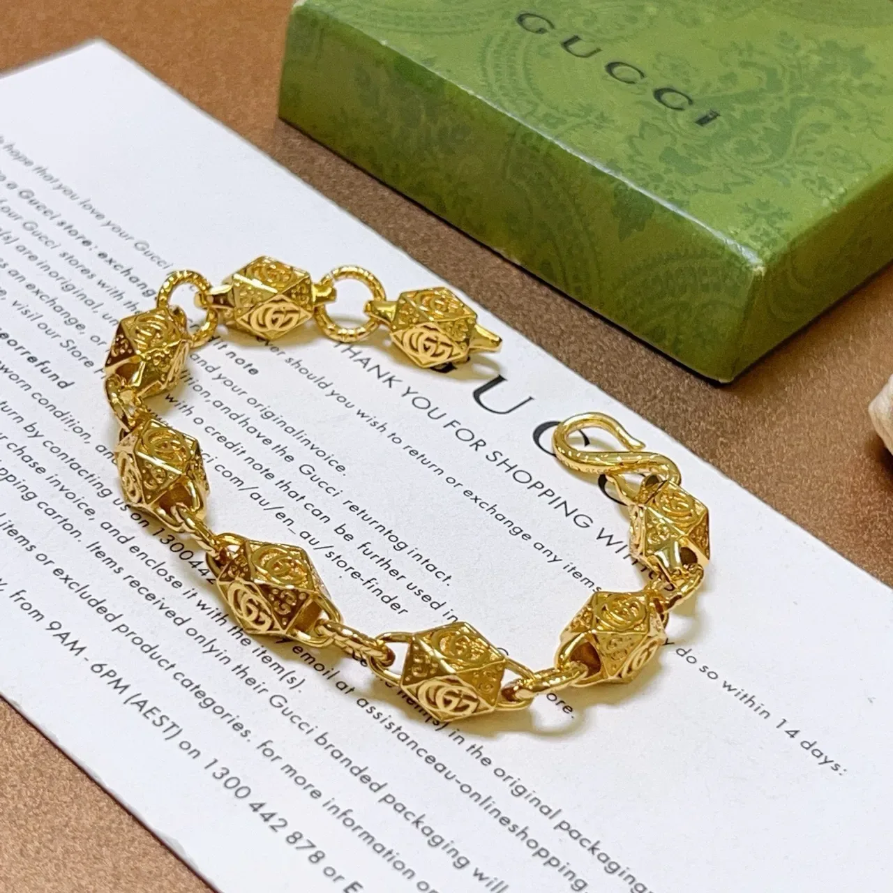 Gucci Gold-Toned Geometric GG Motif Bracelet 9