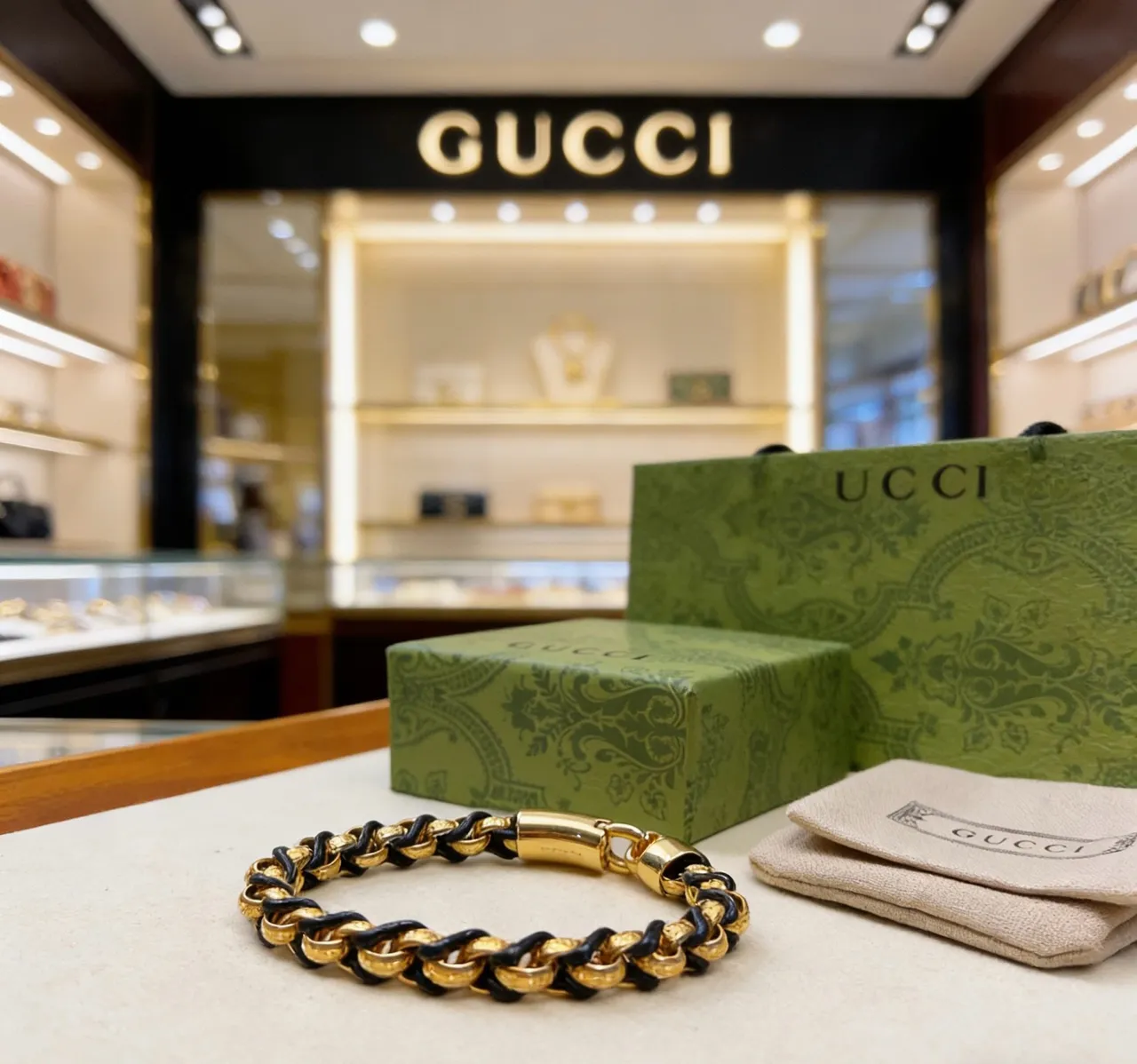 Gucci Interwoven Gold and Black Leather Chain Bracelet 2
