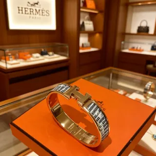 Hermès Clic H Gold Black Rigid Bangle Toggle Clasp Bracelet