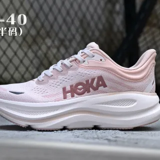 Hoka أحذية جري وردي أبيض مع وجهة نسيج هندسي مصممة وسادة كثيفة في المنتصف