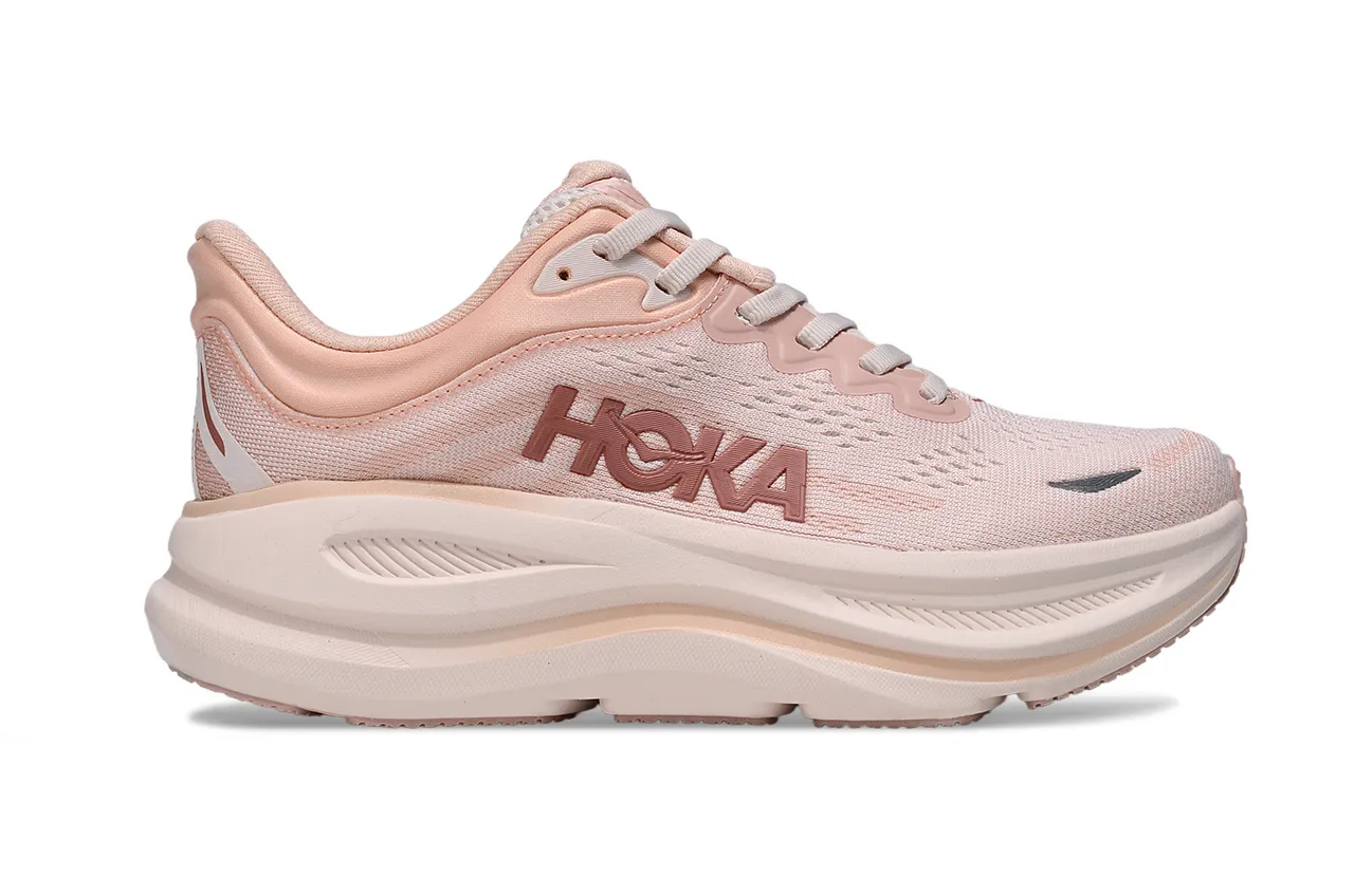 Hoka Chaussures de course roses et blanches avec upper en maille ingénierie, semelle intermédiaire épaisse amortie 2