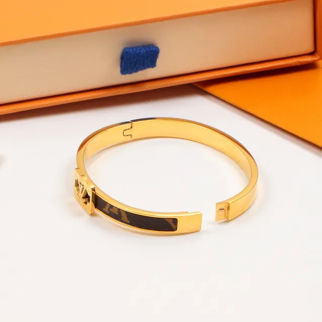 Louis Vuitton bracelet rigide à charnière doré marron avec incrustation cuir monogramme 2