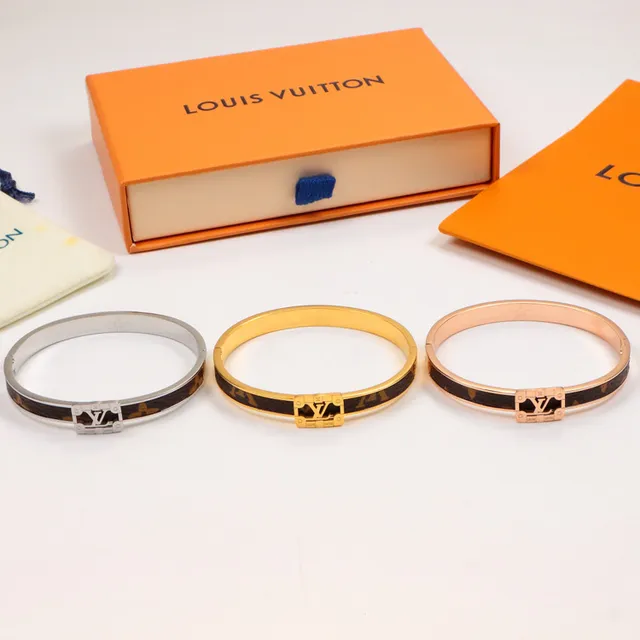 Louis Vuitton bracelet rigide à charnière doré marron avec incrustation cuir monogramme 6