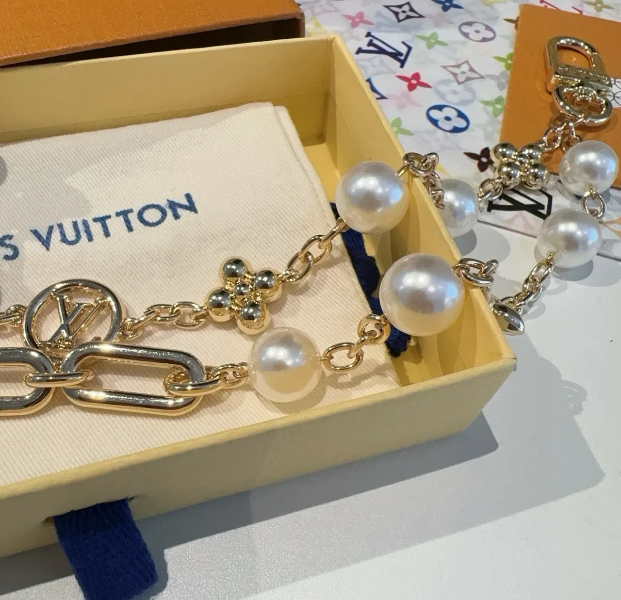 Louis Vuitton Gold-Tone Oval Link Pearl and LV Medallion Bracelet 4
