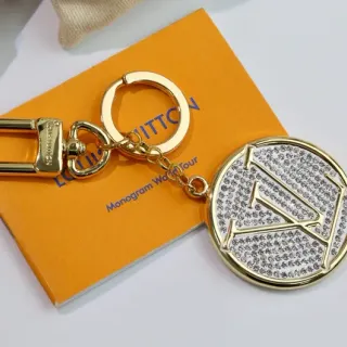 Louis Vuitton Pulsera de metal blanco y dorado con cristales y monograma