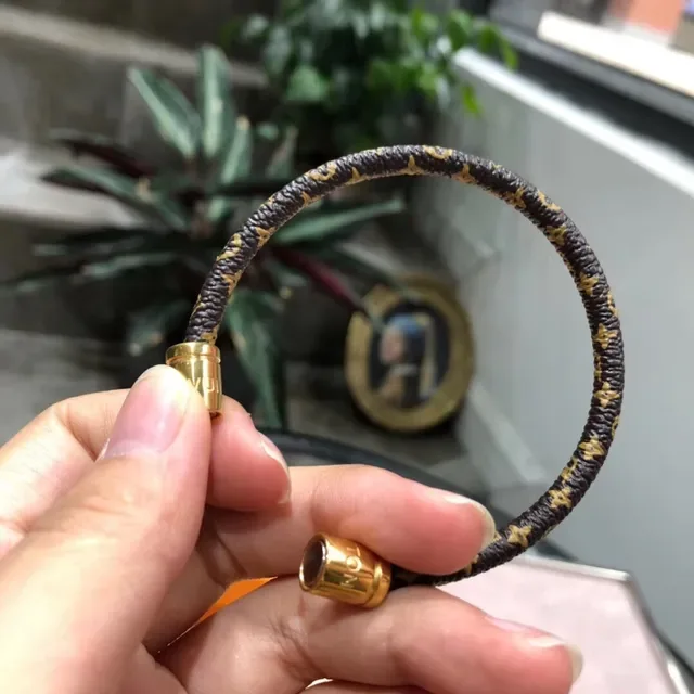 Louis Vuitton Monogram Leather Bracelet Black Gold Braided Cylindrical Magnetic Clasp Bracelet 4