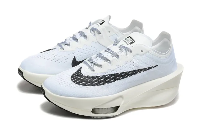 Nike White Black Knit Upper Asymmetrical Sculpted Midsole Running Shoes 3