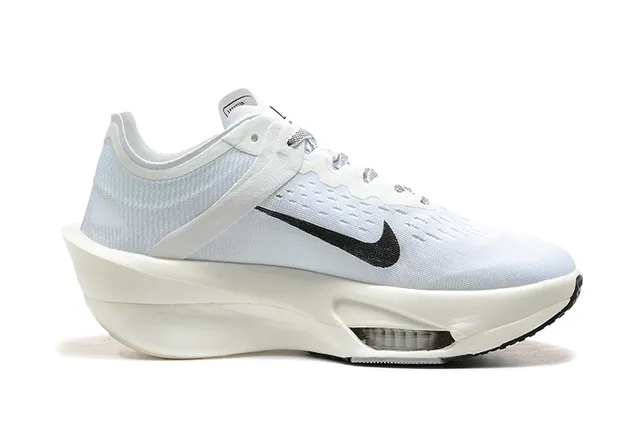 Nike White Black Knit Upper Asymmetrical Sculpted Midsole Running Shoes 6