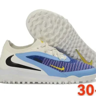 Nike Zapatos de fútbol turf blanco azul de bajo corte con upper de knit asimétrico en jaula asimétrica