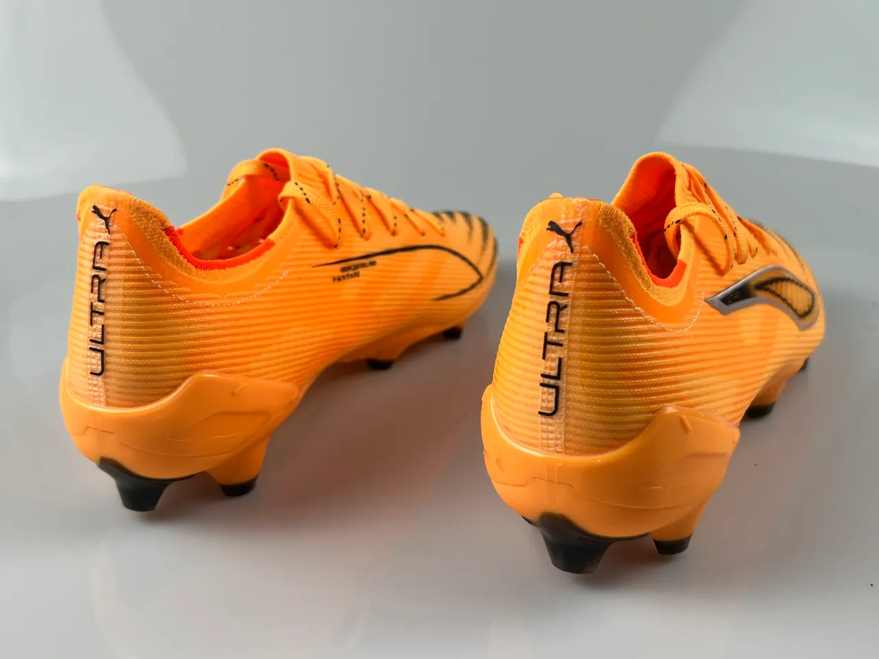 Puma Ultra Orange Black লো-কাট লেস-আপ রিবড সিন্থেটিক আপার ফার্ম-গ্রাউন্ড ফুটবল জুতো 8