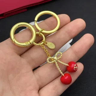 سوار فالنتينو كرز قوس ذهبي أحمر معدن ملتوي حبل