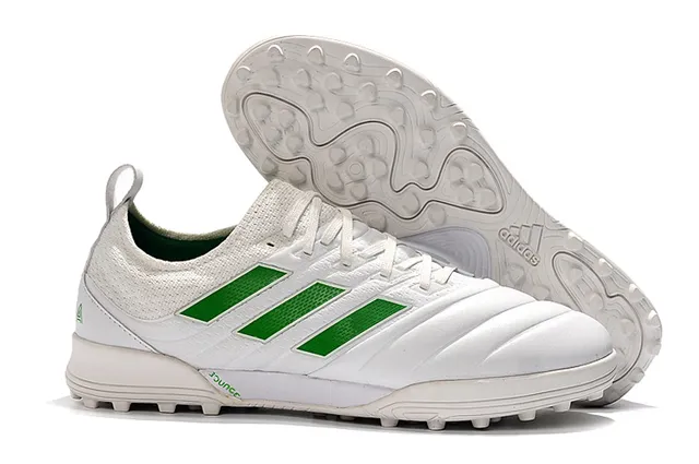 Adidas Chaussures de football Turf en noir et orange avec upper en knit et synthétique 3 rayures 3