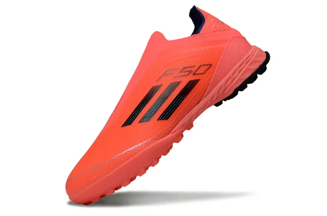 Adidas Chaussures de football turf orange noir slip-on avec upper sock-fit, studs coniques moldés 3