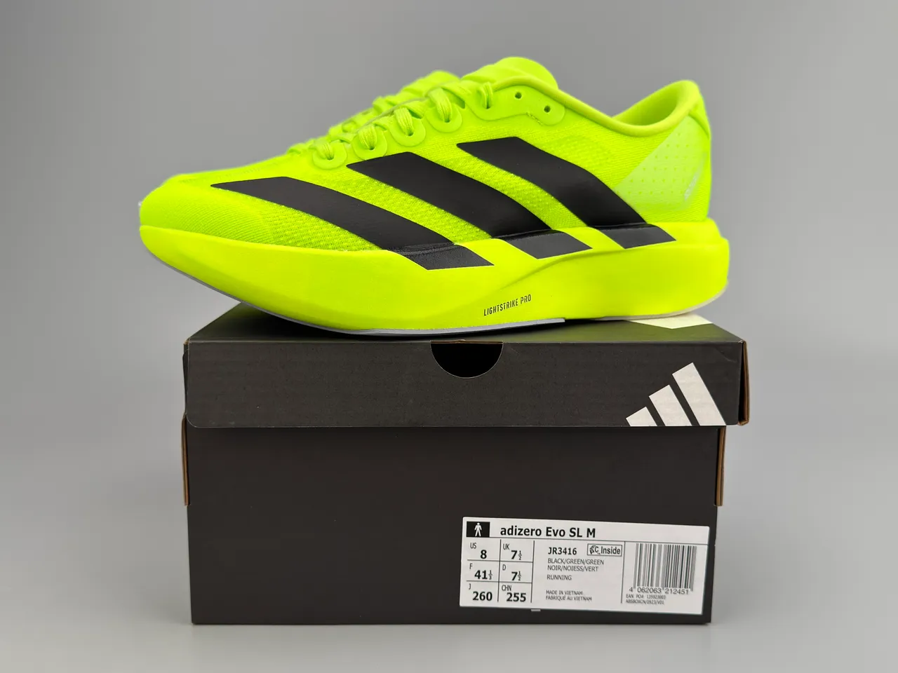 Adidas Tênis de corrida com parte superior em knit neon amarelo preto, branding de três listras 4