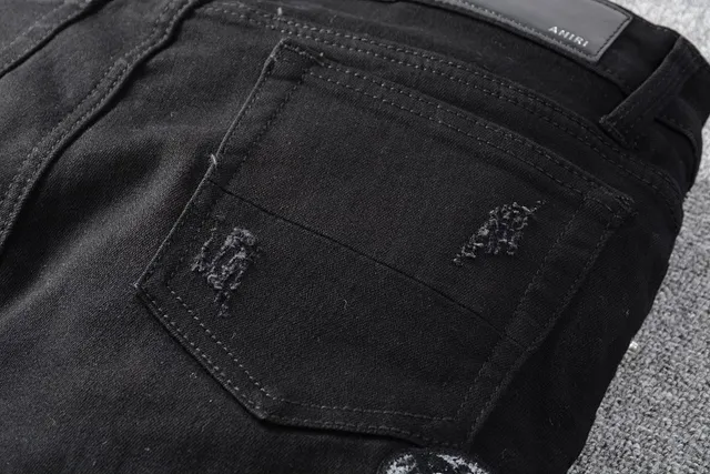Amiri Motivo de serpente distressed slim-fit calça jeans preta 3