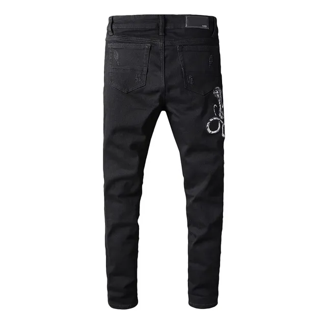 Amiri Motivo de serpente distressed slim-fit calça jeans preta 5
