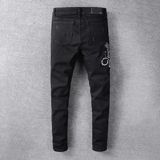 Amiri Motivo de serpente distressed slim-fit calça jeans preta 6