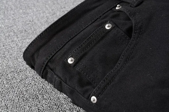 Amiri Motivo de serpente distressed slim-fit calça jeans preta 9