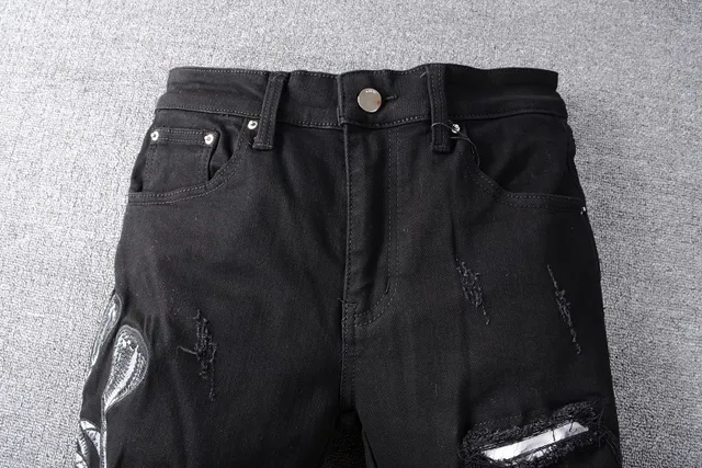 Amiri Motivo de serpente distressed slim-fit calça jeans preta 12