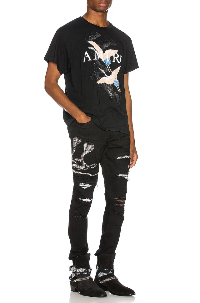 Amiri Motivo de serpente distressed slim-fit calça jeans preta 15