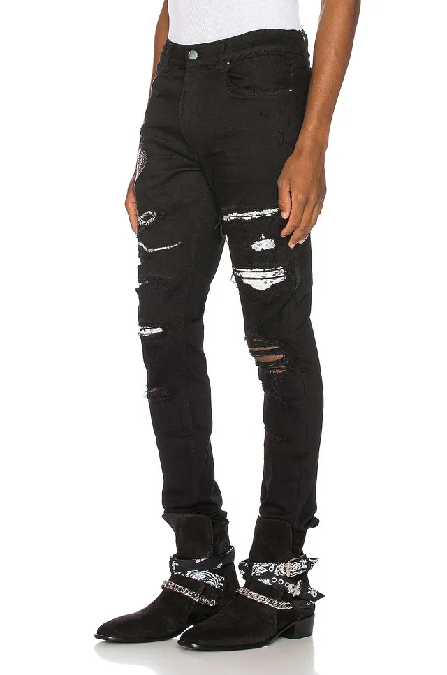 Amiri Motivo de serpente distressed slim-fit calça jeans preta 17