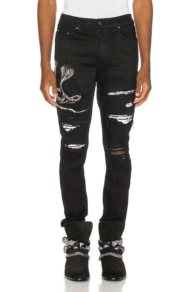 Amiri Motivo de serpente distressed slim-fit calça jeans preta 18