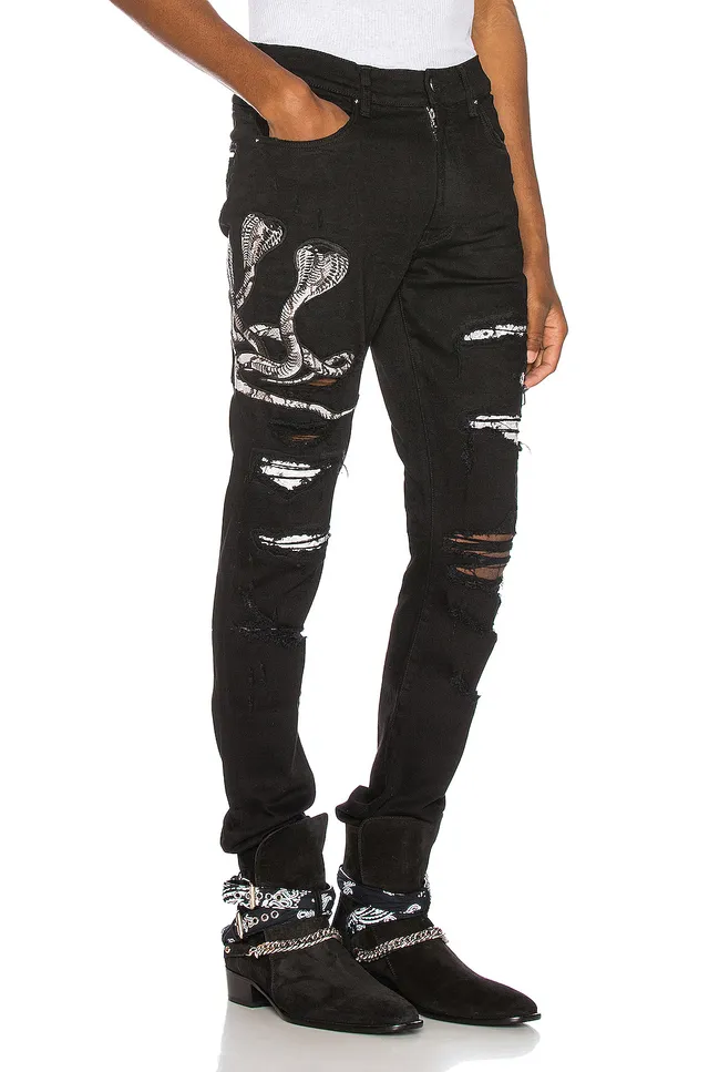 Amiri Motivo de serpente distressed slim-fit calça jeans preta 19