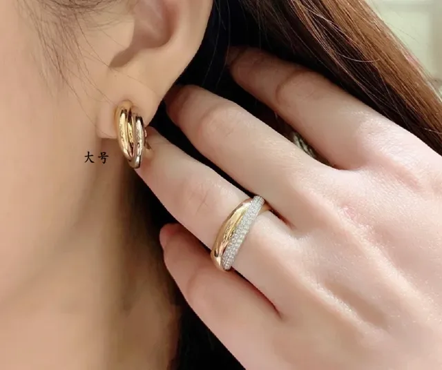 Boucles d'oreilles Cartier Trinity Triple-Band Twisted Hoop 9