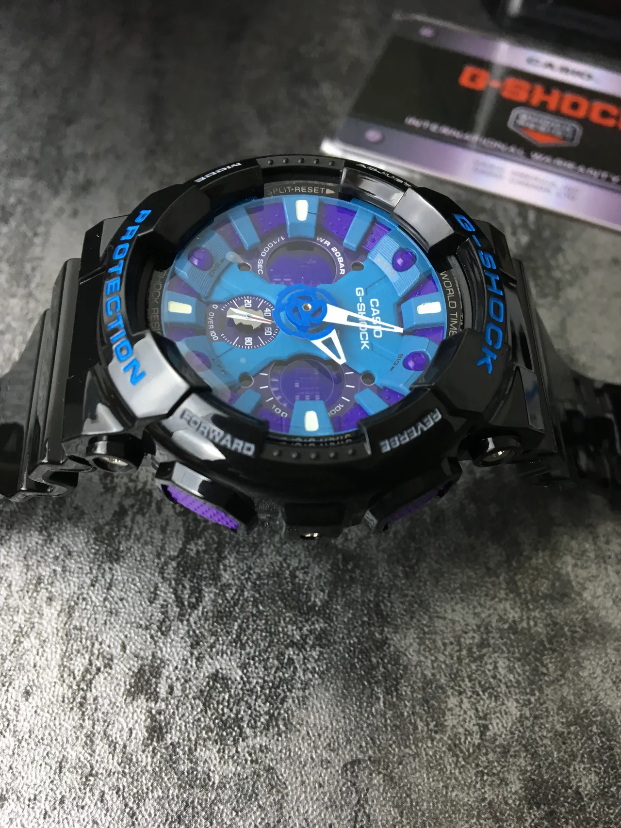 Casio G-Shock GA-100 ساعة رياضية بقرص أزرق وأرجواني متعدد الطبقات 4