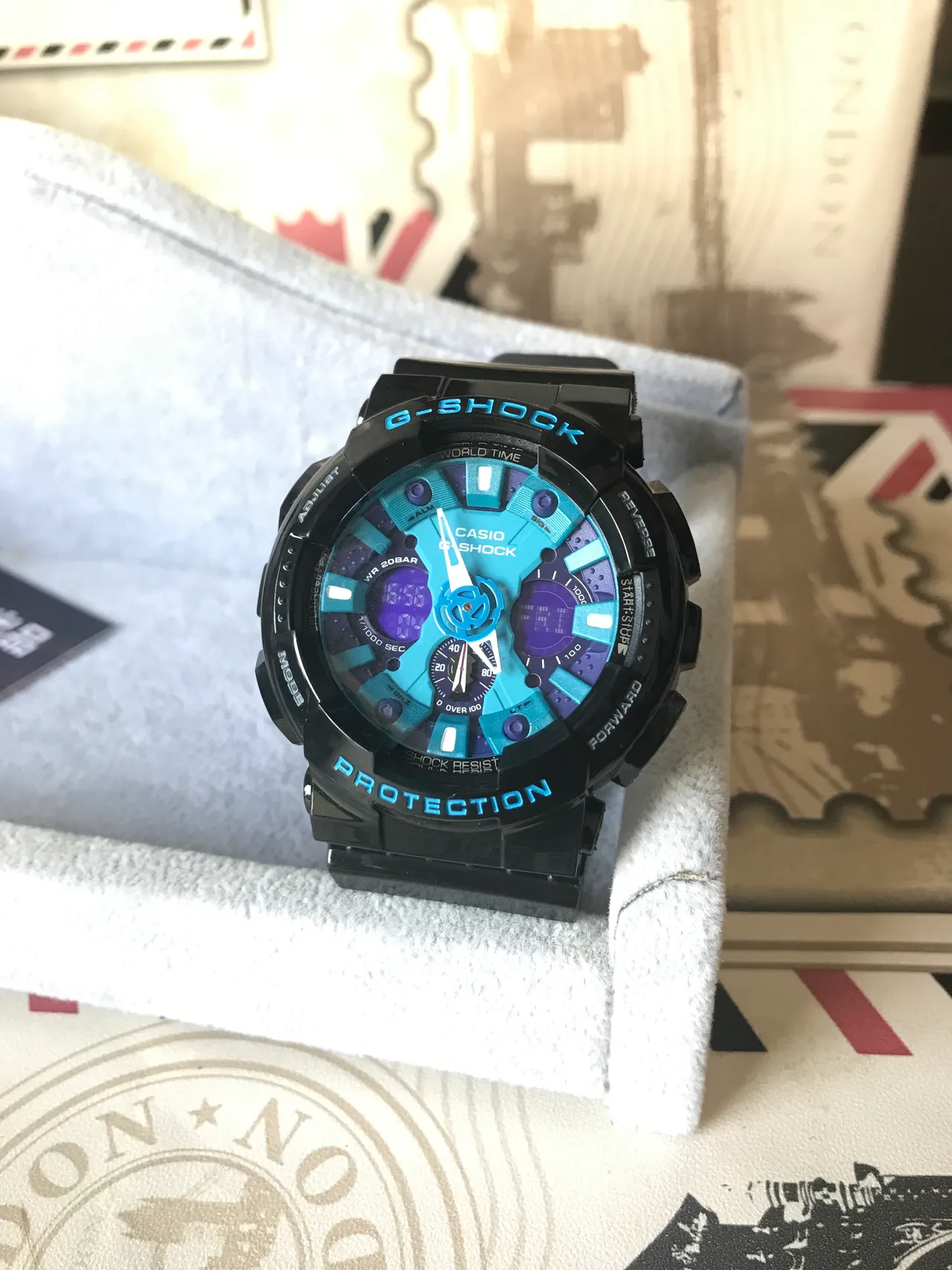 Casio G-Shock GA-100 ساعة رياضية بقرص أزرق وأرجواني متعدد الطبقات 9