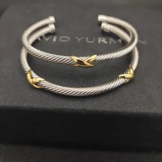 David Yurman Cable Classics سوارات فضة وذهب ملتوية