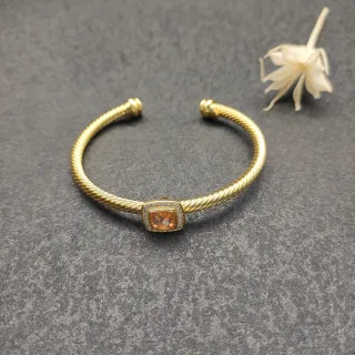 Pulsera de muñeca abierta con banda de cable trenzada de oro y naranja