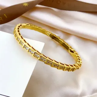 سوار ذهبي اللون هندسي مع باڤيه سيت ريجيد