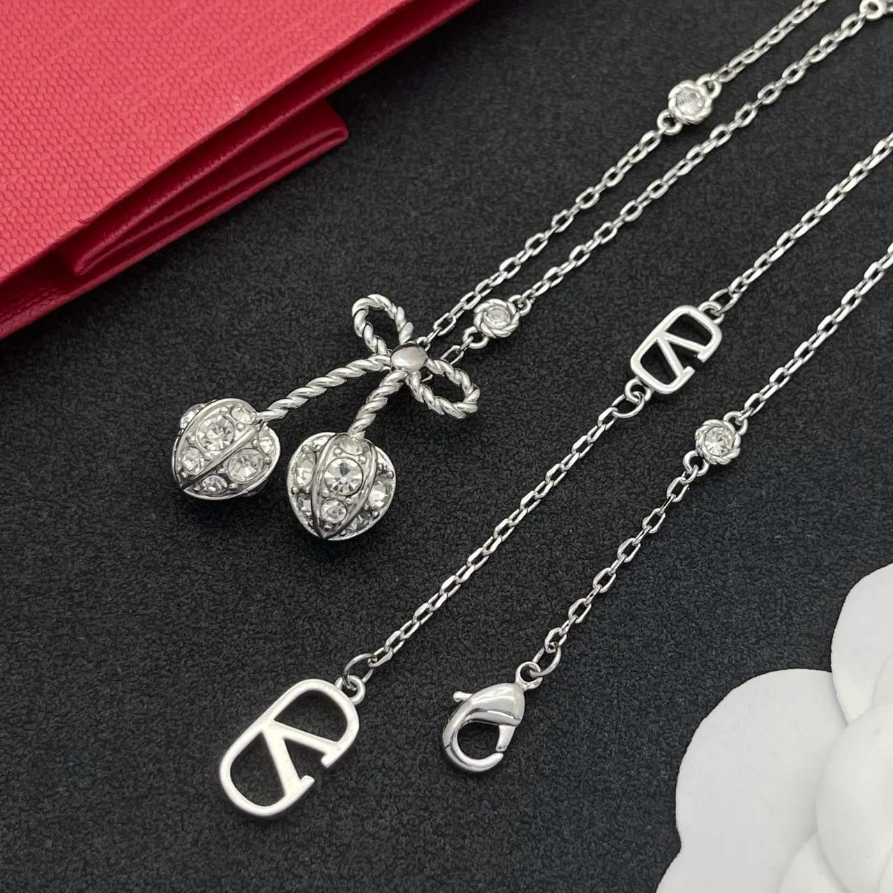 Silver-Tone Bow and Cherry Pendant Necklace 5