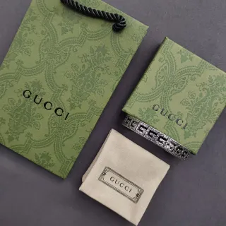 Gucci G-Link pulsera de metal de tono plateado con motivo G ornamentado entrelazado