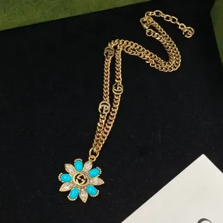 Gucci गोल्ड ब्लू कर्व चेन फ्लोरल डेजी पेंडेंट नेकलेस