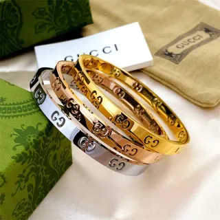 Gucci Gold Silver Rigid Bangle Interlocking GG Motif Bracelet