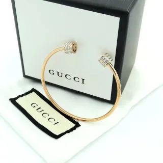 سوار Gucci Rotating Crystal G-Logo ذهبي فضي برميل مفتوح