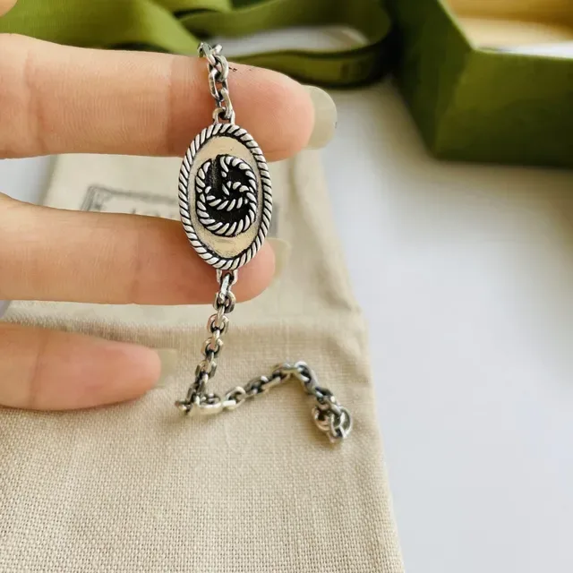 Gucci Silver-Toned Oval Rope-Edge Knot Medallion Bracelet 8