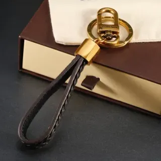 Louis Vuitton Brown Gold Braided Leather Hardware Wristlet