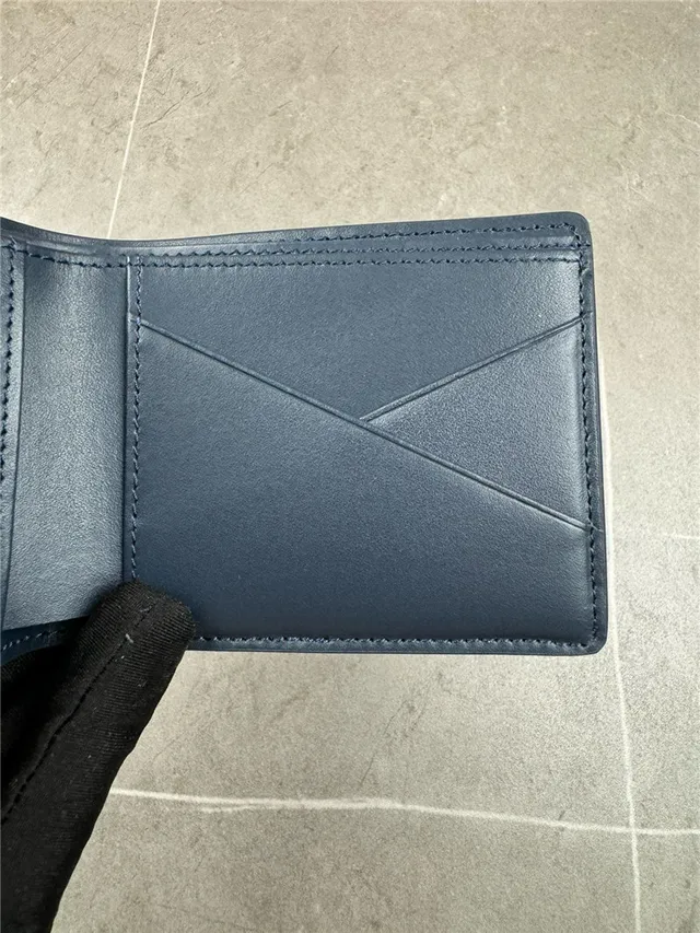 Louis Vuitton Navy White Embossed Monogram Bifold Construction Short Wallet 2
