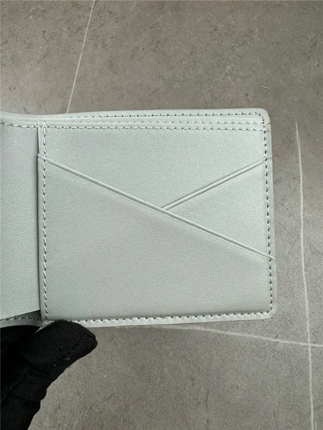Louis Vuitton Navy White Embossed Monogram Bifold Construction Short Wallet 9