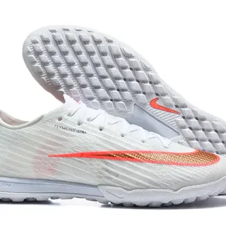 Nike zapatillas de fútbol turf blancas y naranjas con upper de tejido Flyweave y cuello bajo