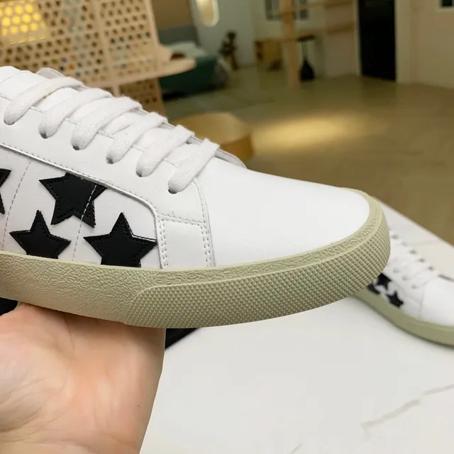 Saint Laurent sneakers lifestyle blancs noirs en cuir supérieur avec appliqués étoile 2