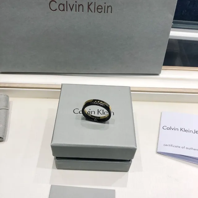 Calvin Klein Two-Tone Engraved Gold and Black Ring 2