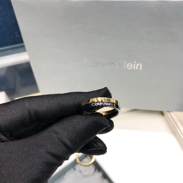 Calvin Klein Two-Tone Engraved Gold and Black Ring 4