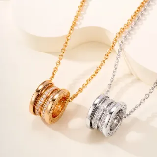 Colliers avec pendentif or et argent ton multi-anneau pavé